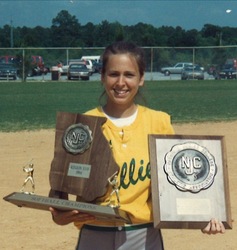 Picture of Lee Watson holding trophy and plaque.